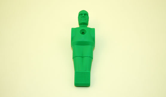 Joueur de babyfoot en vert, en matière synthétique